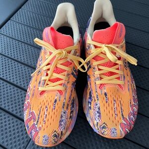 Orange and Yellow Athletic Shoes with Abstract Pattern
